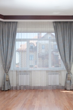 Large windows adorned with custom draperies