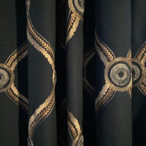 close-up of dark custom drapery with gold pattern