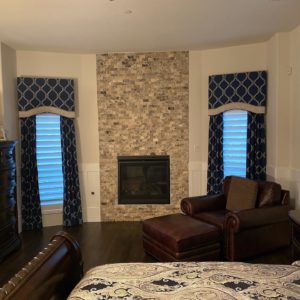 bedroom with beautiful printed custom window treatments in Dallas