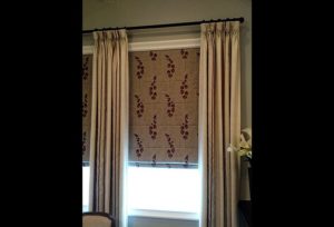 Layered window treatments in Dallas — Roman shades and curtains