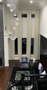Tasteful family room outfitted with custom drapery in Richardson