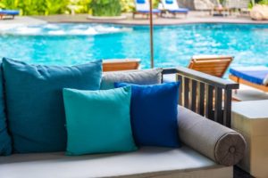 Comfy outdoor sofa next to swimming pool