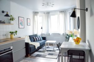 Small apartment with sheer curtains over the windows