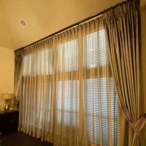 Beautiful custom draperies on floor to ceiling windows