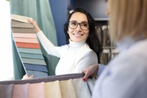 Homeowner and designer looking at fabric samples